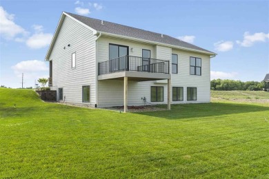 This beautiful Hodge Construction built home overlooks on Saddleback Ridge Golf Course in Iowa - for sale on GolfHomes.com, golf home, golf lot