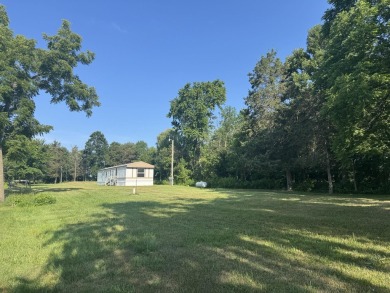 Looking for affordable country living? This charming 2-bedroom on Beeches Golf Club  in Michigan - for sale on GolfHomes.com, golf home, golf lot