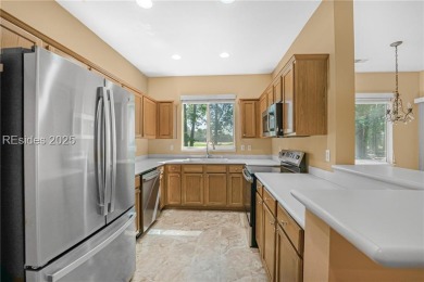 This two bedroom, two bath Hawthorne model has a great golf view on Okatie Creek Golf Club in South Carolina - for sale on GolfHomes.com, golf home, golf lot