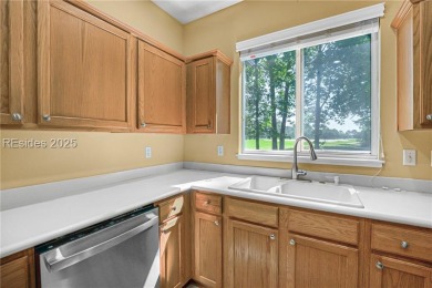 This two bedroom, two bath Hawthorne model has a great golf view on Okatie Creek Golf Club in South Carolina - for sale on GolfHomes.com, golf home, golf lot