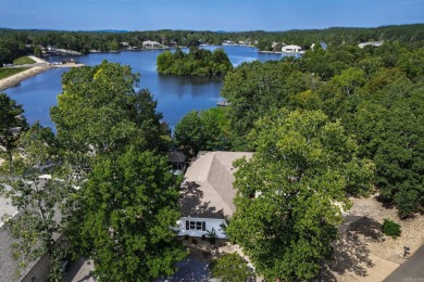Welcome to your lakeside retreat on the desirable east side and on Granada Golf Course in Arkansas - for sale on GolfHomes.com, golf home, golf lot