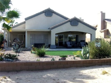 Nestled amidst the lush golf course greens and mountain vistas on Mojave Resort Golf Club in Nevada - for sale on GolfHomes.com, golf home, golf lot