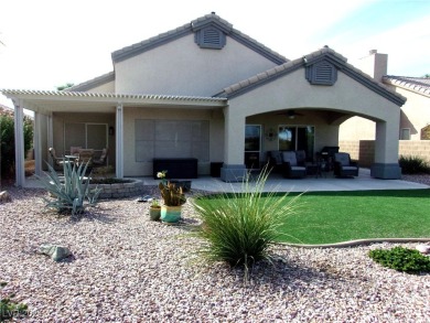 Nestled amidst the lush golf course greens and mountain vistas on Mojave Resort Golf Club in Nevada - for sale on GolfHomes.com, golf home, golf lot