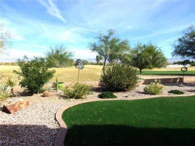 Nestled amidst the lush golf course greens and mountain vistas on Mojave Resort Golf Club in Nevada - for sale on GolfHomes.com, golf home, golf lot