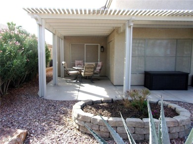 Nestled amidst the lush golf course greens and mountain vistas on Mojave Resort Golf Club in Nevada - for sale on GolfHomes.com, golf home, golf lot