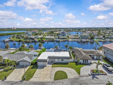 If you want to live in one of the most desirable waterfront on Gulf Harbors Golf Course in Florida - for sale on GolfHomes.com, golf home, golf lot
