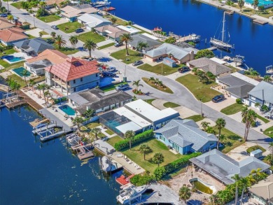 If you want to live in one of the most desirable waterfront on Gulf Harbors Golf Course in Florida - for sale on GolfHomes.com, golf home, golf lot