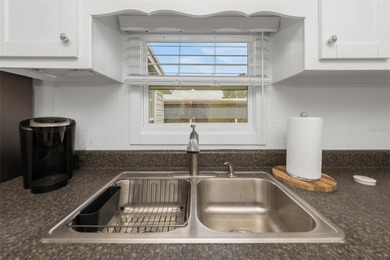 This adorable home has been meticulously and lovingly maintained on Fairway Village Golf Course in Florida - for sale on GolfHomes.com, golf home, golf lot