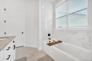 Skip the hassle of building and move right into this like-new on Metamora Country Club in Michigan - for sale on GolfHomes.com, golf home, golf lot