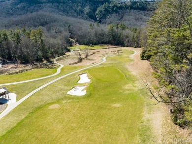 This .52-acre lot nestled on Fairway Drive sits on 4 golf hole on Lake Toxaway Country Club in North Carolina - for sale on GolfHomes.com, golf home, golf lot