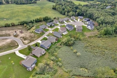 Skip the hassle of building and move right into this like-new on Metamora Country Club in Michigan - for sale on GolfHomes.com, golf home, golf lot