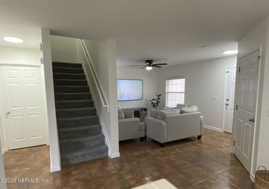 Charming and inviting townhome located in the desirable Fleming on Golf Club At Fleming Island in Florida - for sale on GolfHomes.com, golf home, golf lot