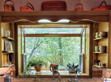 Discover this remarkable Lindal Cedar Home, thoughtfully crafted on Doe Valley Country Club in Kentucky - for sale on GolfHomes.com, golf home, golf lot