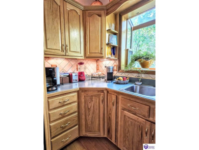 Discover this remarkable Lindal Cedar Home, thoughtfully crafted on Doe Valley Country Club in Kentucky - for sale on GolfHomes.com, golf home, golf lot