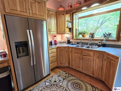 Discover this remarkable Lindal Cedar Home, thoughtfully crafted on Doe Valley Country Club in Kentucky - for sale on GolfHomes.com, golf home, golf lot