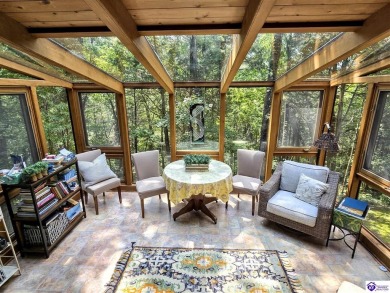 Discover this remarkable Lindal Cedar Home, thoughtfully crafted on Doe Valley Country Club in Kentucky - for sale on GolfHomes.com, golf home, golf lot