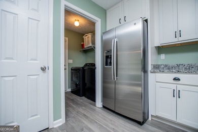 Live the Fairfield Plantation lifestyle! Stylish stepless ranch on Fairfield Plantation Golf and Country Club in Georgia - for sale on GolfHomes.com, golf home, golf lot