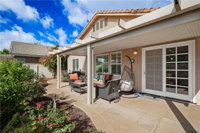 Discover the epitome of comfortable, carefree living in this on Menifee Lakes Country Club - Lakes in California - for sale on GolfHomes.com, golf home, golf lot