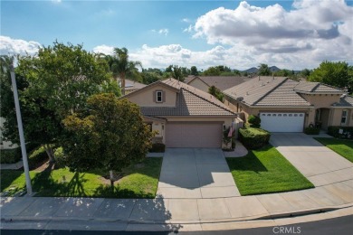 Discover the epitome of comfortable, carefree living in this on Menifee Lakes Country Club - Lakes in California - for sale on GolfHomes.com, golf home, golf lot