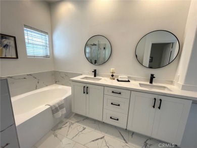 Experience luxurious living in this stunning tri-level townhome on Tustin Ranch Golf Club in California - for sale on GolfHomes.com, golf home, golf lot