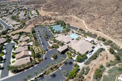 Discover the epitome of comfortable, carefree living in this on Menifee Lakes Country Club - Lakes in California - for sale on GolfHomes.com, golf home, golf lot