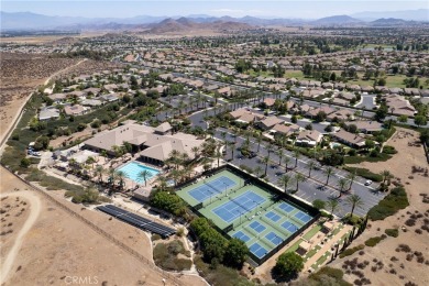 Discover the epitome of comfortable, carefree living in this on Menifee Lakes Country Club - Lakes in California - for sale on GolfHomes.com, golf home, golf lot