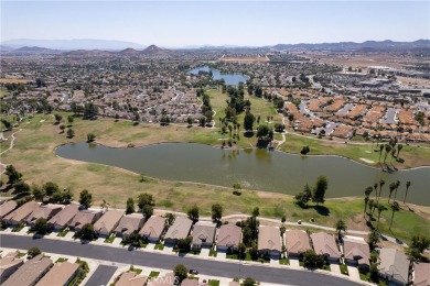 Discover the epitome of comfortable, carefree living in this on Menifee Lakes Country Club - Lakes in California - for sale on GolfHomes.com, golf home, golf lot