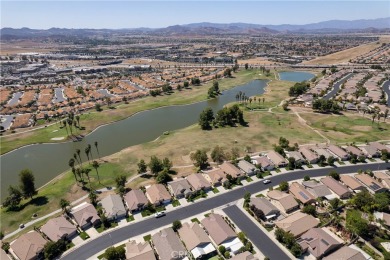 Discover the epitome of comfortable, carefree living in this on Menifee Lakes Country Club - Lakes in California - for sale on GolfHomes.com, golf home, golf lot