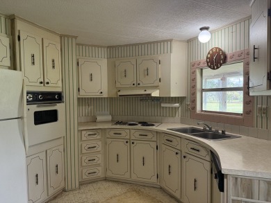 Ready to Renovate! Situated on a beautiful golf course lot in on Rolling Greens Executive Golf Community in Florida - for sale on GolfHomes.com, golf home, golf lot