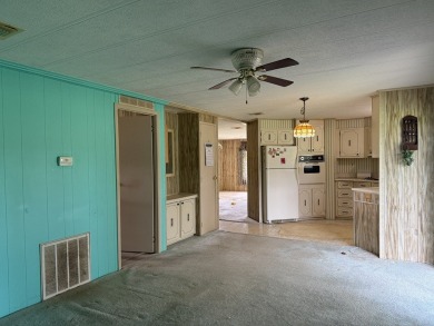 Ready to Renovate! Situated on a beautiful golf course lot in on Rolling Greens Executive Golf Community in Florida - for sale on GolfHomes.com, golf home, golf lot