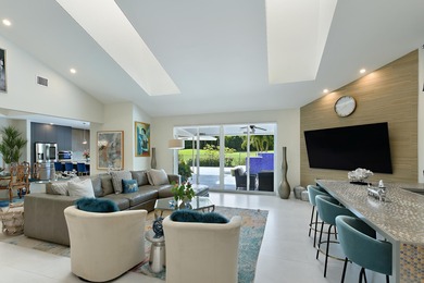 This elegantly remodeled contemporary pool home is located in on Boca Grove Golf and Tennis in Florida - for sale on GolfHomes.com, golf home, golf lot