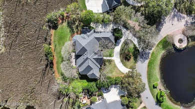 Views, views, views! The golf and nature vistas from this custom on Marsh Landing Country Club - Saint Johns County in Florida - for sale on GolfHomes.com, golf home, golf lot
