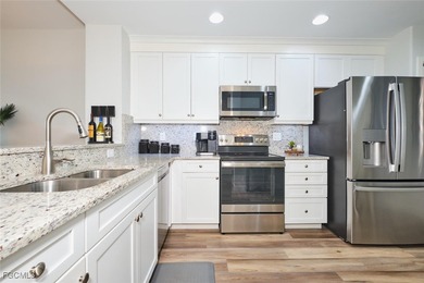 Breathtaking lake and golf course views from this 2 bedroom Golf on Lexington Country Club in Florida - for sale on GolfHomes.com, golf home, golf lot