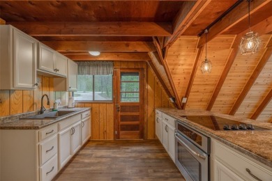Welcome to your perfect weekend escape. This cozy chalet sits on on Innsbrook Resort Golf Course in Missouri - for sale on GolfHomes.com, golf home, golf lot