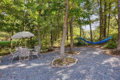 Discover your dream lakeside escape with this stunning Pocono on Pinecrest Lake Golf and Country Club in Pennsylvania - for sale on GolfHomes.com, golf home, golf lot