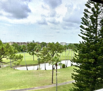Beautiful view from balcony of golf course and water this 2/2 is on Poinciana Golf Club in Florida - for sale on GolfHomes.com, golf home, golf lot