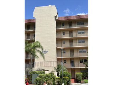 Beautiful view from balcony of golf course and water this 2/2 is on Poinciana Golf Club in Florida - for sale on GolfHomes.com, golf home, golf lot