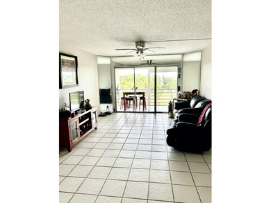 Beautiful view from balcony of golf course and water this 2/2 is on Poinciana Golf Club in Florida - for sale on GolfHomes.com, golf home, golf lot