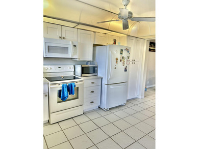 Beautiful view from balcony of golf course and water this 2/2 is on Poinciana Golf Club in Florida - for sale on GolfHomes.com, golf home, golf lot