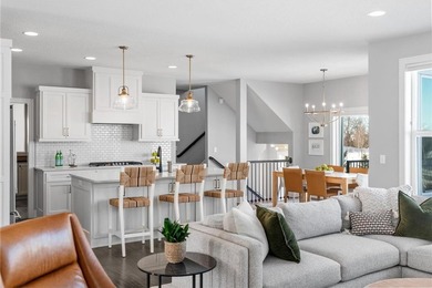 Discover refined living in this former NIH Custom Builders on Rush Creek Golf Club in Minnesota - for sale on GolfHomes.com, golf home, golf lot