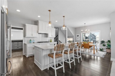 Discover refined living in this former NIH Custom Builders on Rush Creek Golf Club in Minnesota - for sale on GolfHomes.com, golf home, golf lot