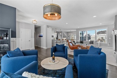 Discover refined living in this former NIH Custom Builders on Rush Creek Golf Club in Minnesota - for sale on GolfHomes.com, golf home, golf lot