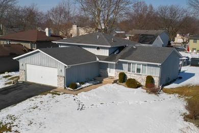 This beautifully maintained 4-bedroom, 2-bath tri-level home is on Lakes of the Four Seasons Country Club in Indiana - for sale on GolfHomes.com, golf home, golf lot