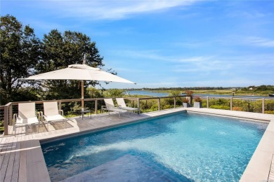 Step into a realm of pure Resort Style living and waterfront on Quogue Field Club in New York - for sale on GolfHomes.com, golf home, golf lot