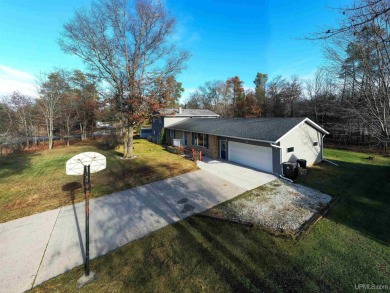 This captivating home on the bluff in Gladstone, located under on Terrace Bluff Golf Course in Michigan - for sale on GolfHomes.com, golf home, golf lot