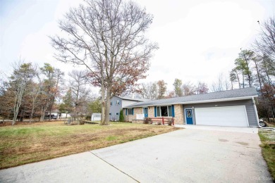 This captivating home on the bluff in Gladstone, located under on Terrace Bluff Golf Course in Michigan - for sale on GolfHomes.com, golf home, golf lot