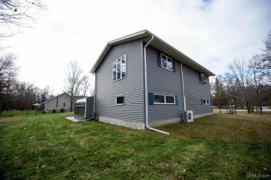 This captivating home on the bluff in Gladstone, located under on Terrace Bluff Golf Course in Michigan - for sale on GolfHomes.com, golf home, golf lot