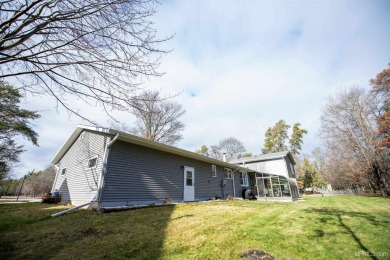 This captivating home on the bluff in Gladstone, located under on Terrace Bluff Golf Course in Michigan - for sale on GolfHomes.com, golf home, golf lot