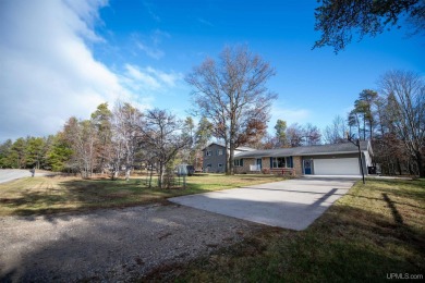 This captivating home on the bluff in Gladstone, located under on Terrace Bluff Golf Course in Michigan - for sale on GolfHomes.com, golf home, golf lot