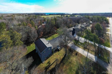 This captivating home on the bluff in Gladstone, located under on Terrace Bluff Golf Course in Michigan - for sale on GolfHomes.com, golf home, golf lot